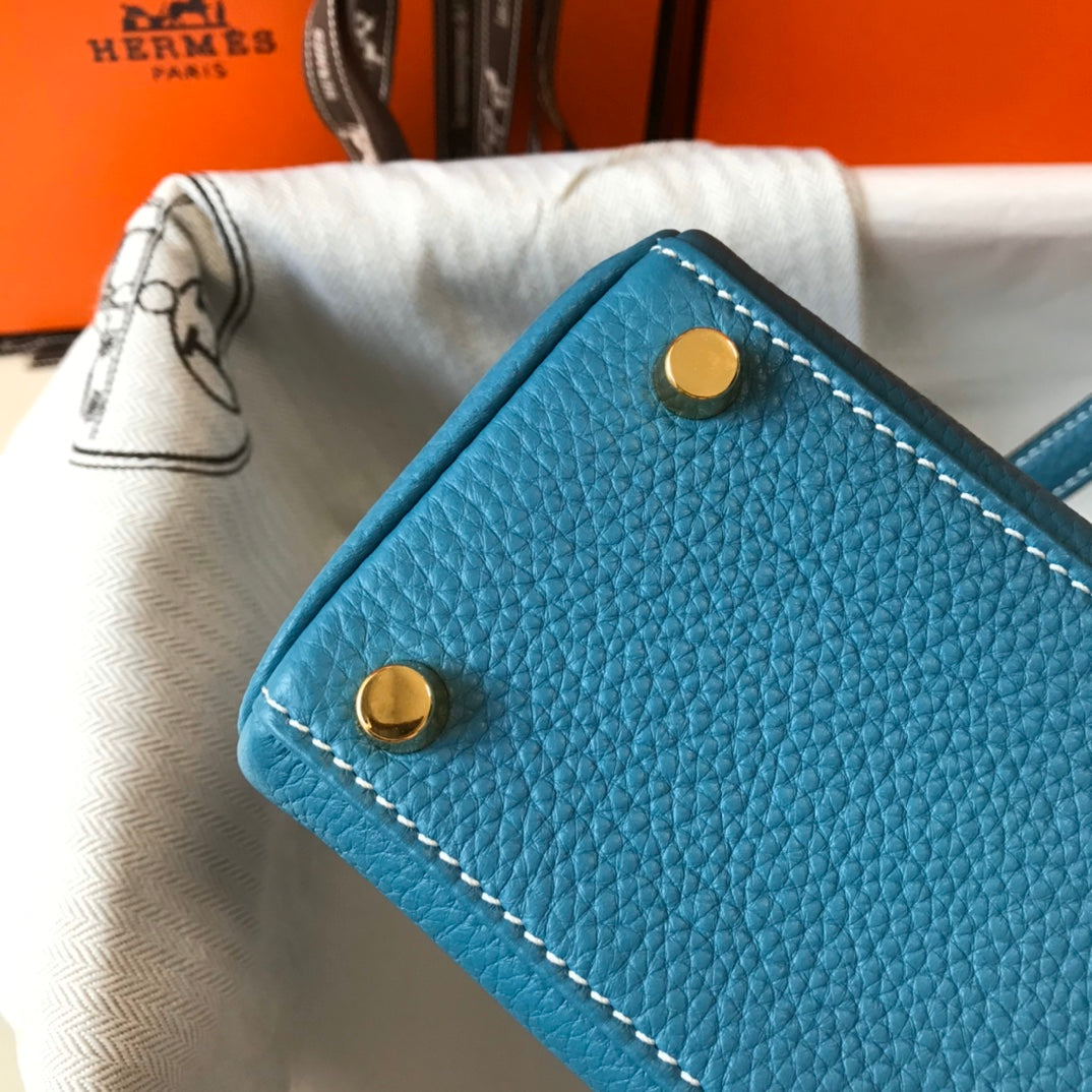 Sac HM Mini Kelly 20 cm en cuir Togo bleu jean avec finitions dorées