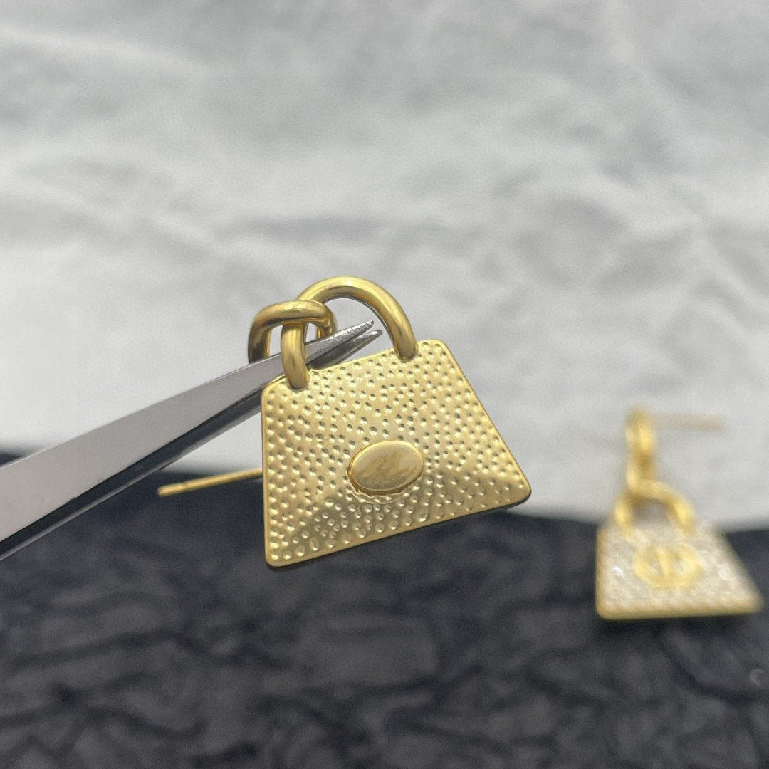 Boucles d'oreilles CD BAG en or et diamants