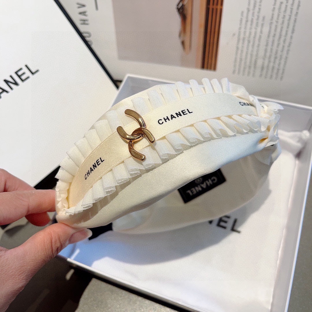 BANDEAU EN TISSU BLANC AVEC LOGO DORÉ 410841