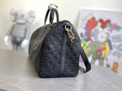 KEEPALL 45 BANDOULIERE MONOGRAMME EMPREINTE GÉANT