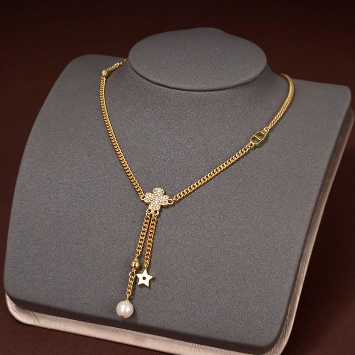 Collier étoile et boule en or et diamants