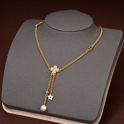 Collier étoile et boule en or et diamants