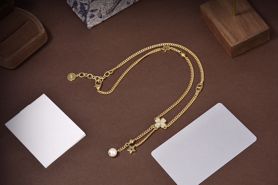 Collier étoile et boule en or et diamants