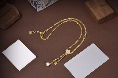 Collier étoile et boule en or et diamants