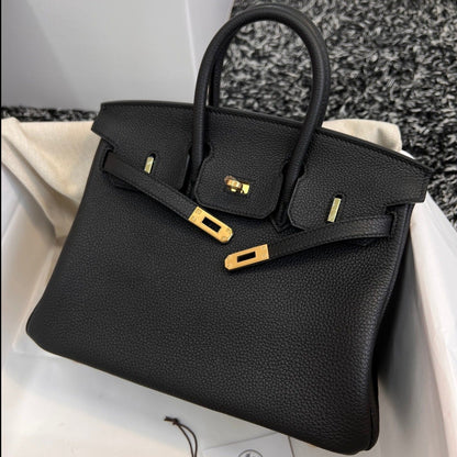Sac HM Birkin 25 cm en cuir Togo noir et métal doré