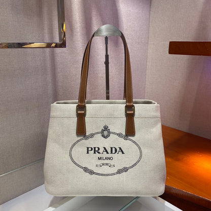 SAC CABAS 33 EN TOILE BLANCHE ET ANSE EN CUIR DE VEAU MARRON