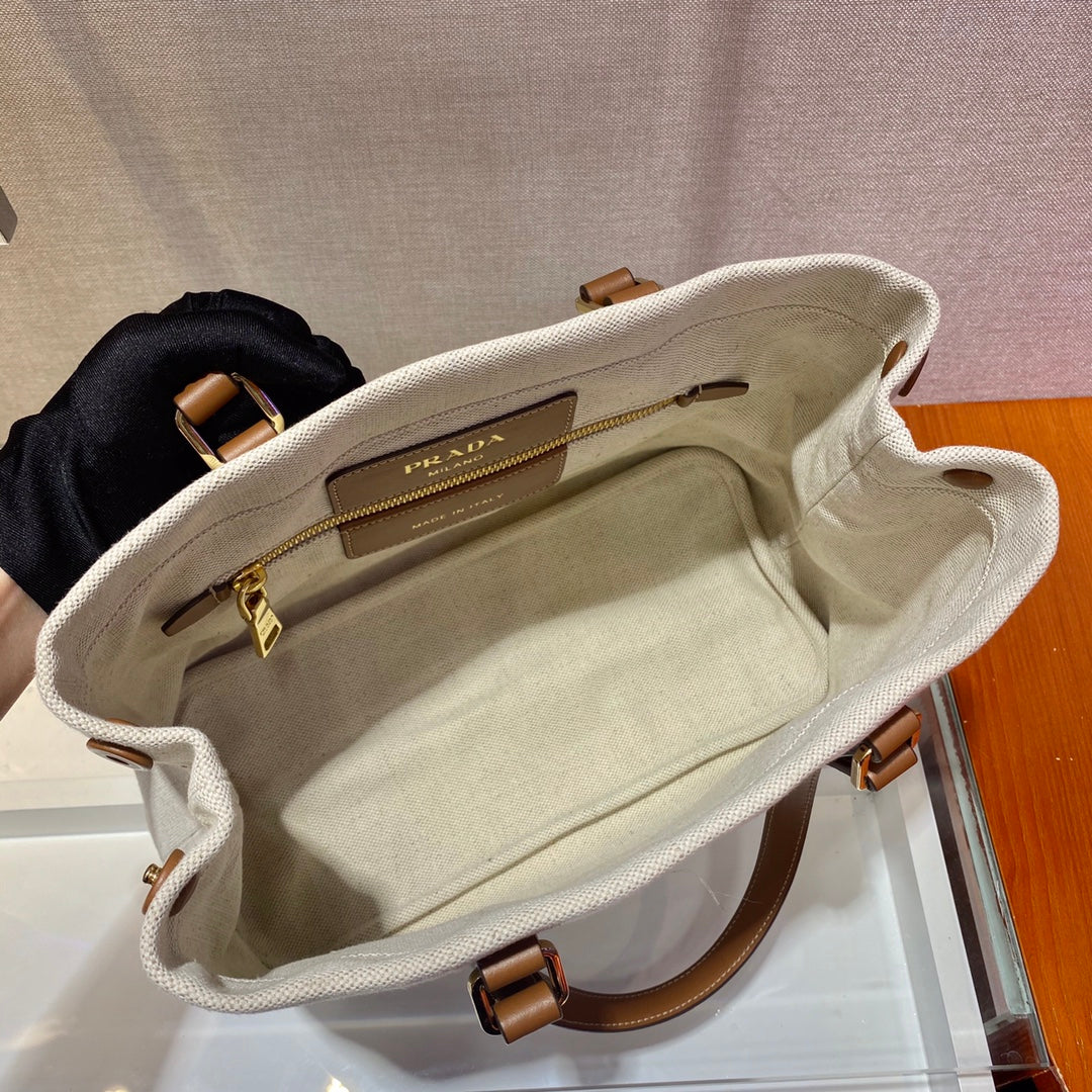 SAC CABAS 33 EN TOILE BLANCHE ET ANSE EN CUIR DE VEAU MARRON