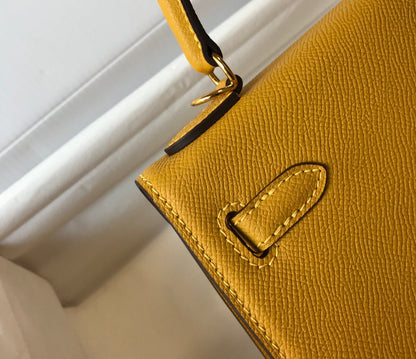 hm kelly 32 cm cuir epsom jaune ferrures dorées