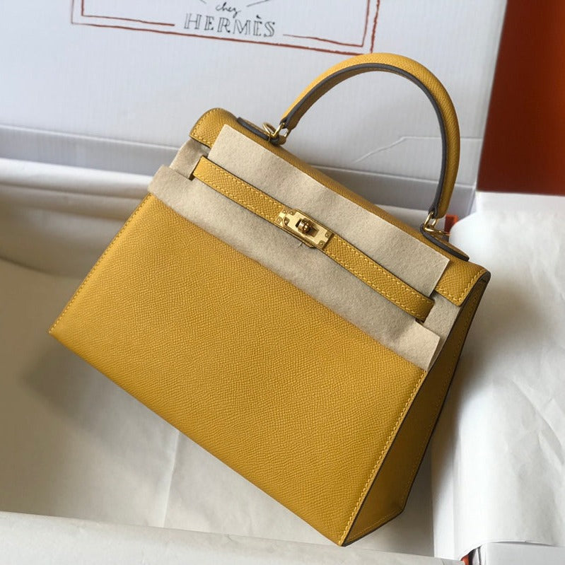 hm kelly 32 cm cuir epsom jaune ferrures dorées