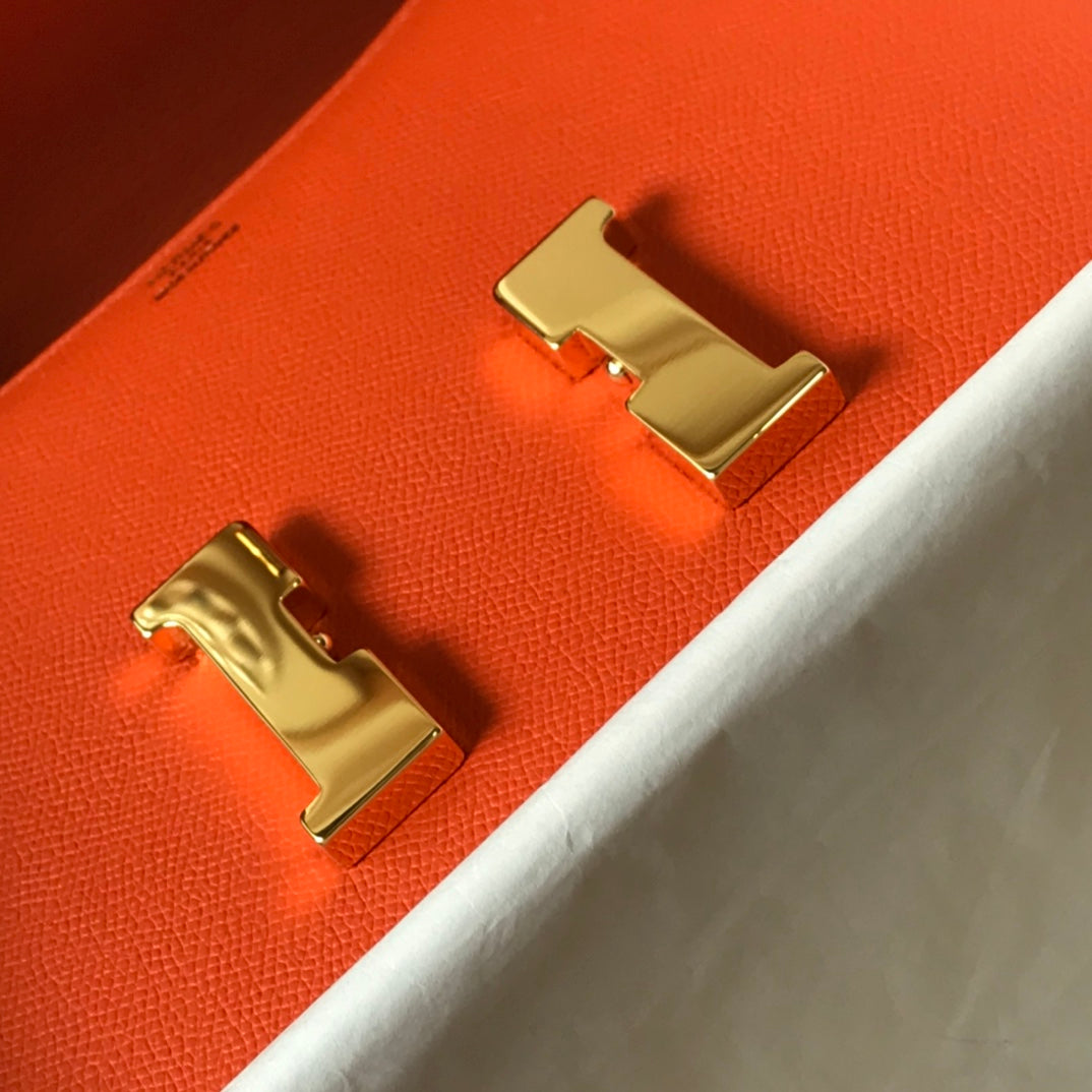 Constance 24 cuir Epsom orange rouge et accessoires dorés
