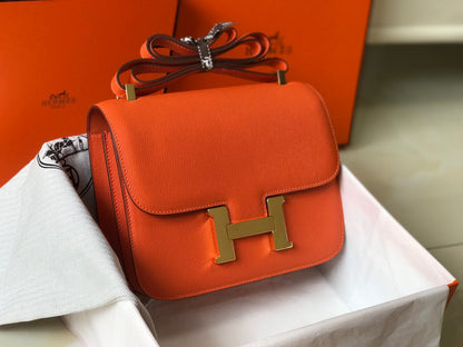 Constance 24 cuir Epsom orange rouge et accessoires dorés