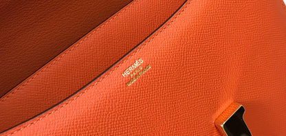 Constance 24 cuir Epsom orange rouge et accessoires dorés