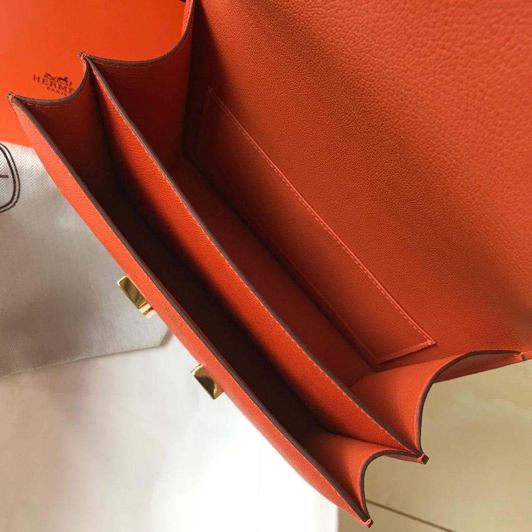 Constance 24 cuir Epsom orange rouge et accessoires dorés