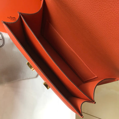 Constance 24 cuir Epsom orange rouge et accessoires dorés