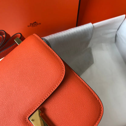 Constance 24 cuir Epsom orange rouge et accessoires dorés