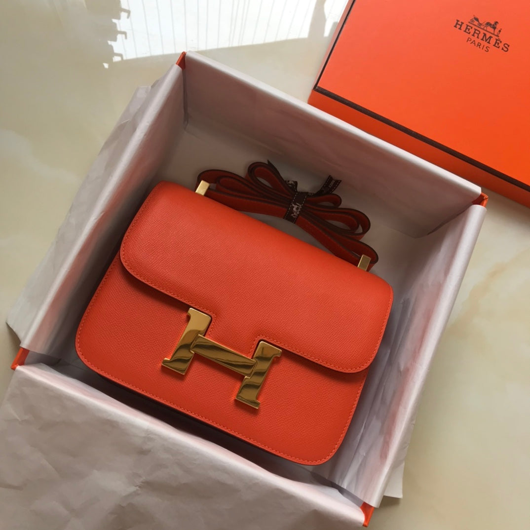 Constance 24 cuir Epsom orange rouge et accessoires dorés