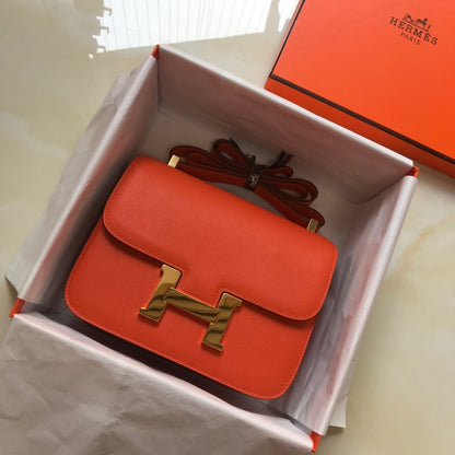 Constance 24 cuir Epsom orange rouge et accessoires dorés