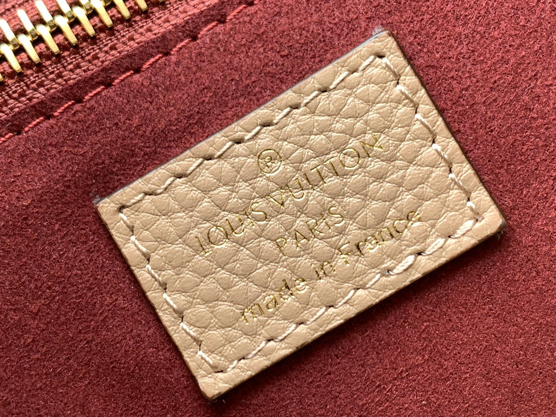 NEVERFULL MM 32 CUIR EMPREINTE MONOGRAMME BEIGE 