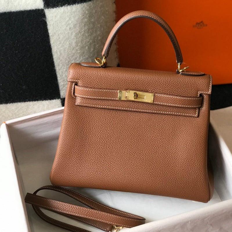 hm kelly 32 cm cuir togo doré accessoires dorés