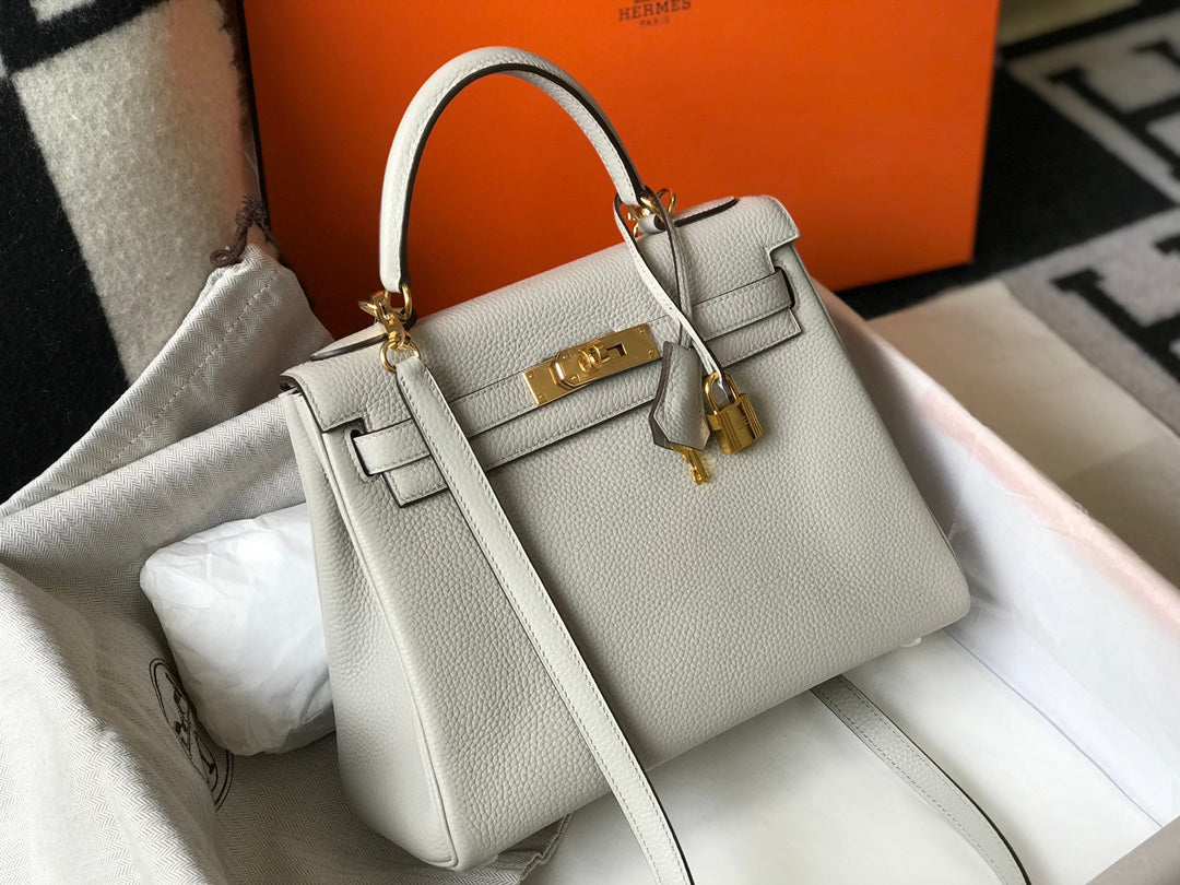 hm kelly 32 cm cuir togo blanc accessoires dorés