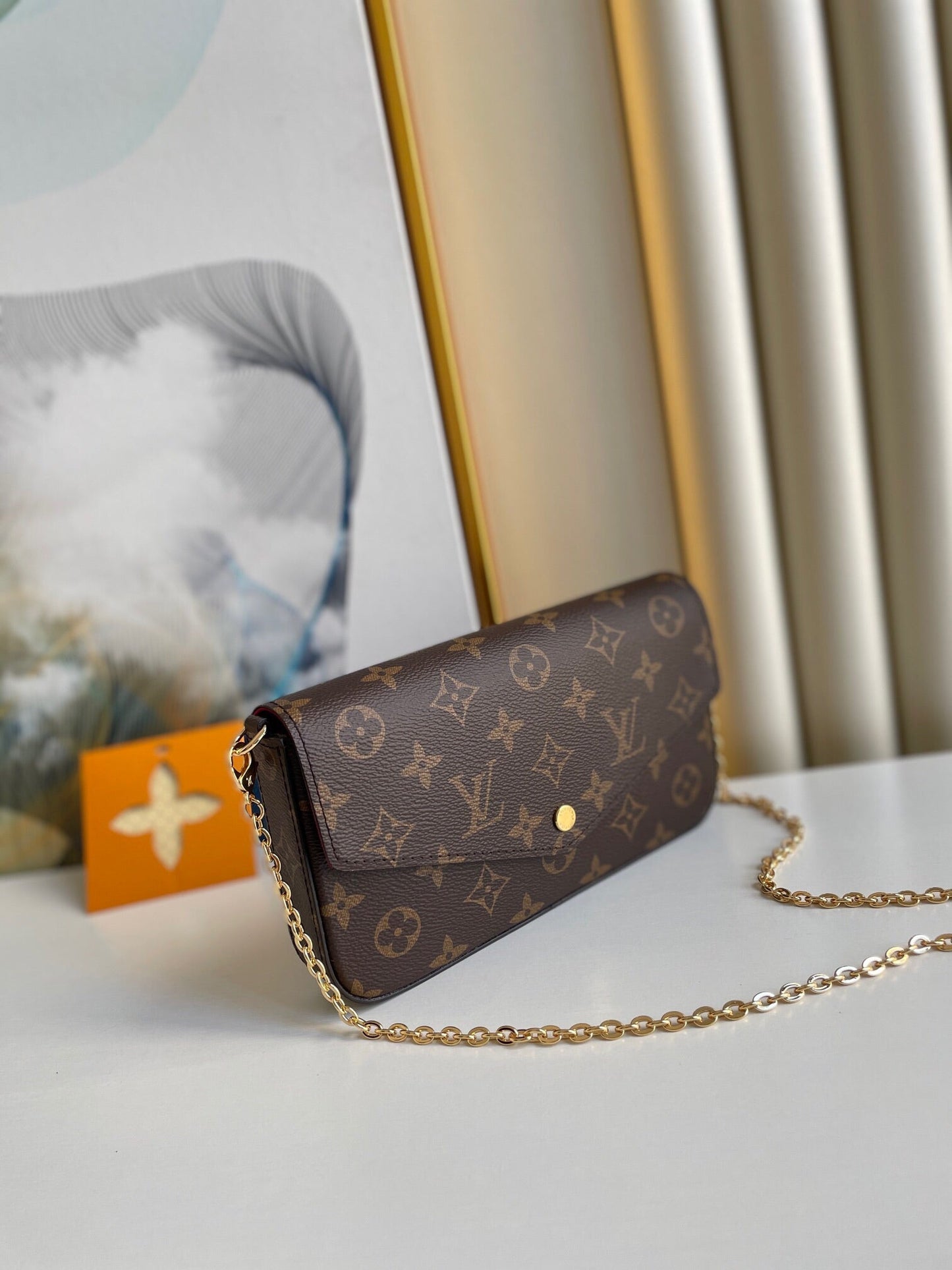 POCHETTE FÉLICIE 21 EN TOILE MONOGRAMME MARRON QUINCAILLERIE DORÉ