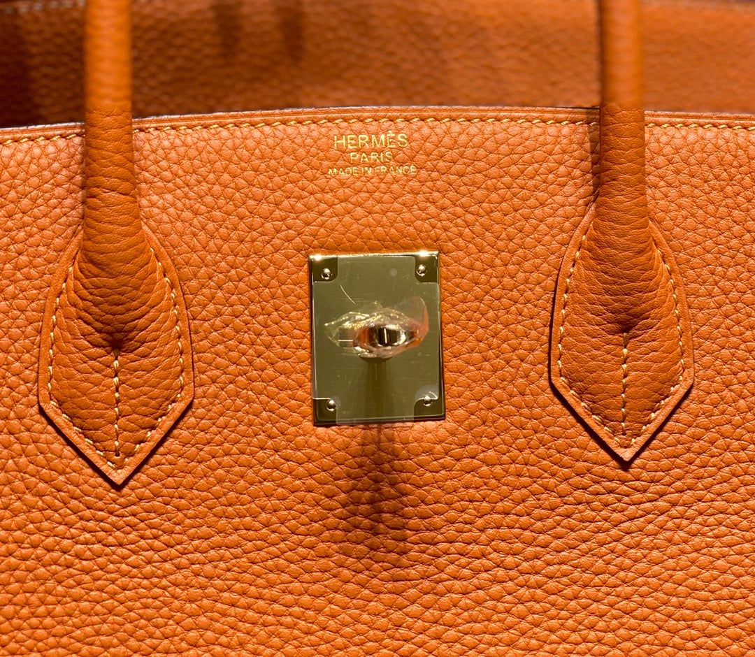 Sac HM Birkin 35 cm en cuir Togo orange et accessoires dorés