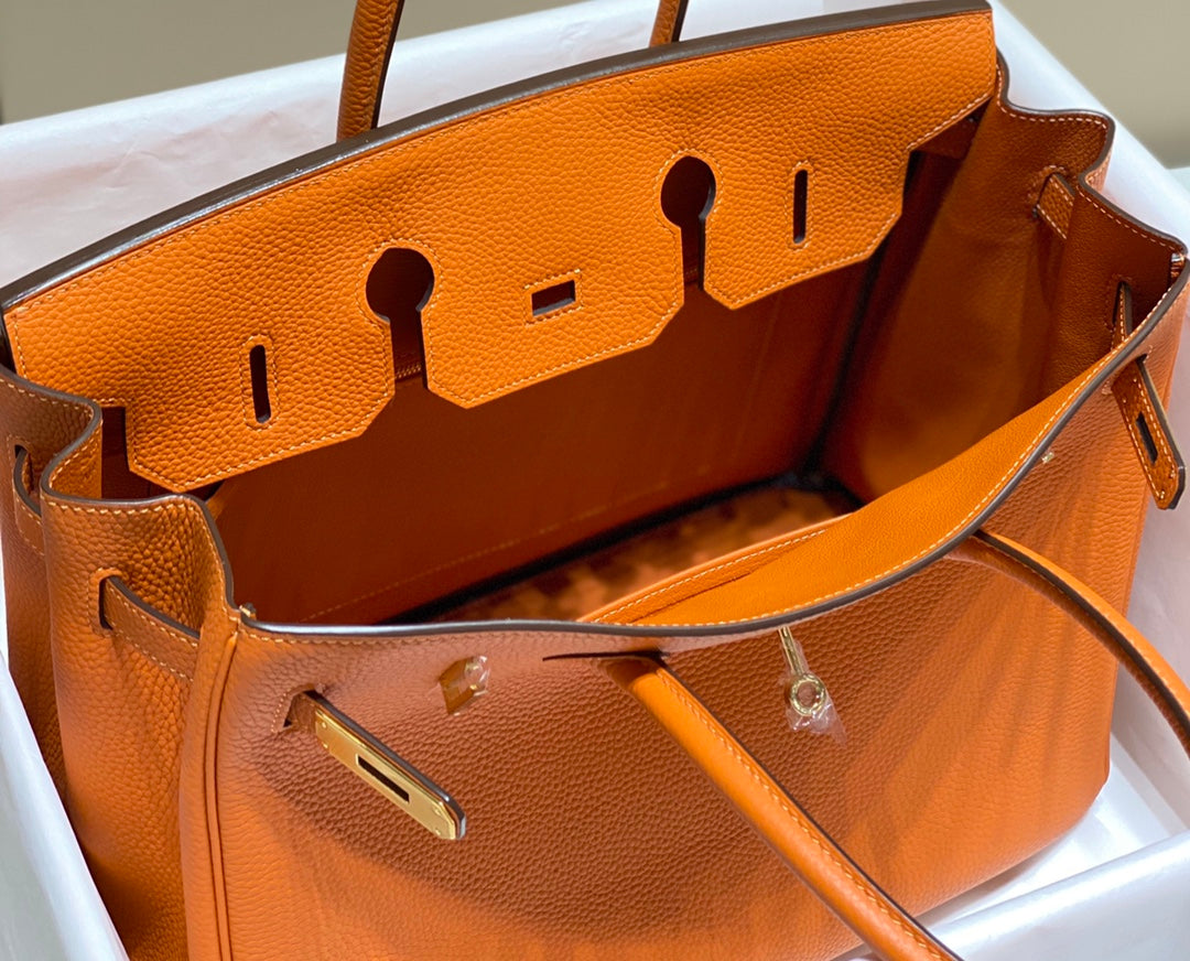 Sac HM Birkin 35 cm en cuir Togo orange et accessoires dorés