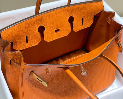 Sac HM Birkin 35 cm en cuir Togo orange et accessoires dorés