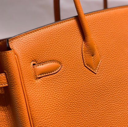 Sac HM Birkin 35 cm en cuir Togo orange et accessoires dorés