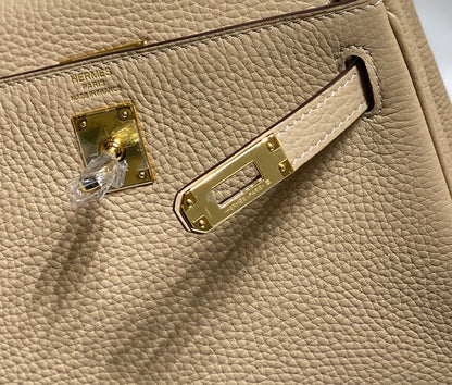 Sac HM Mini Kelly 20 cm en cuir Togo beige avec finitions dorées