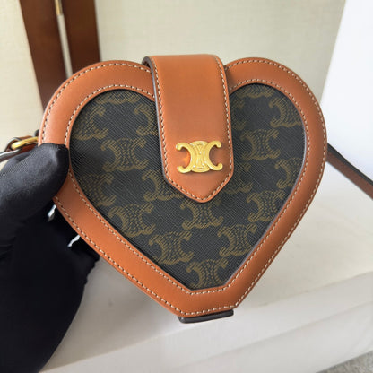 SAC HEART TAMBOUR 15 EN TOILE TRIOMPHE NOIRE ET CUIR DE VEAU MARRON BRONZE