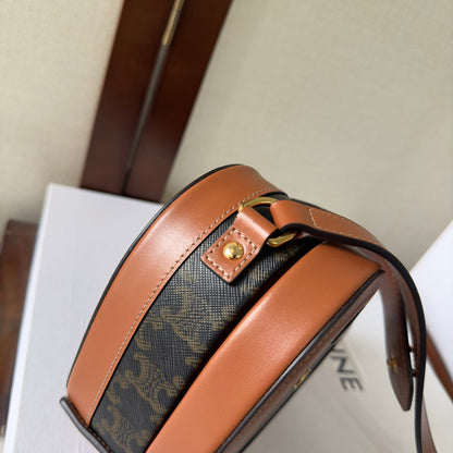 SAC HEART TAMBOUR 15 EN TOILE TRIOMPHE NOIRE ET CUIR DE VEAU MARRON BRONZE