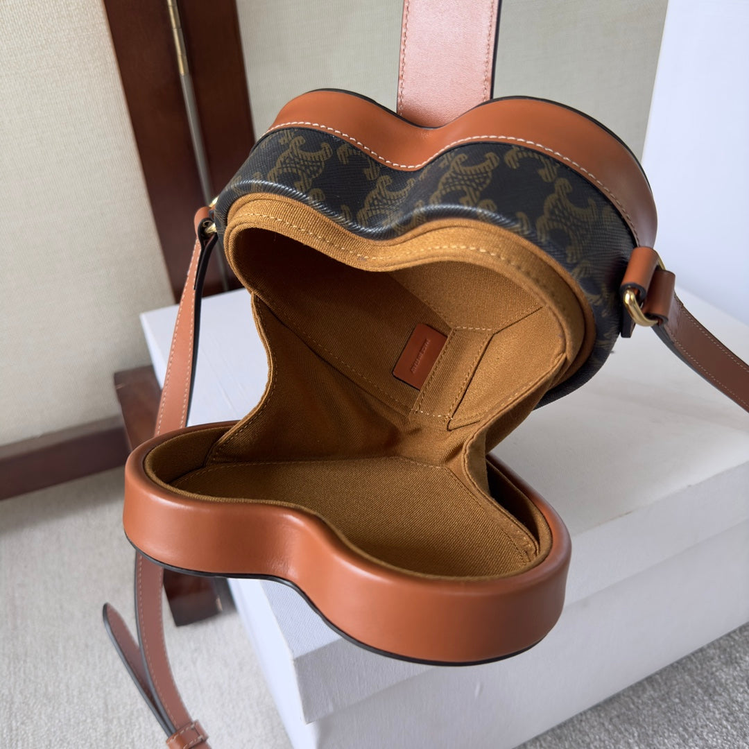 SAC HEART TAMBOUR 15 EN TOILE TRIOMPHE NOIRE ET CUIR DE VEAU MARRON BRONZE