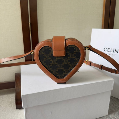 SAC HEART TAMBOUR 15 EN TOILE TRIOMPHE NOIRE ET CUIR DE VEAU MARRON BRONZE