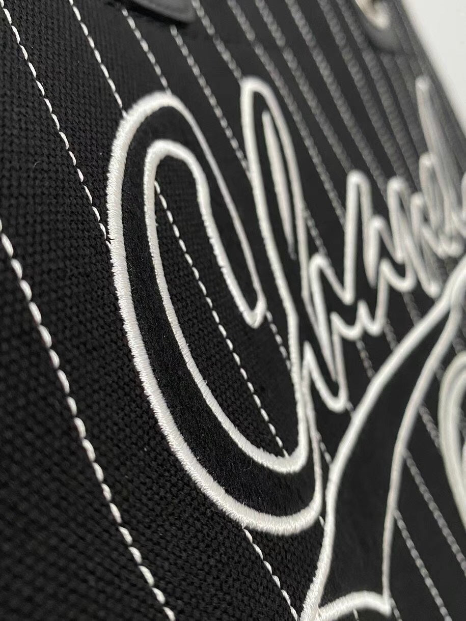 Grand sac fourre-tout CC 50 en toile noire avec bandoulière