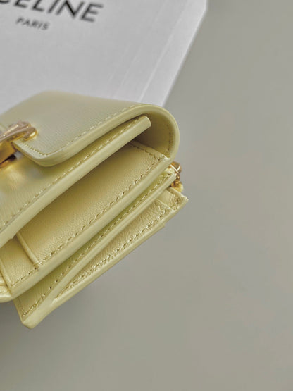 PORTEFEUILLE TRIPHOME 9 DEUX EN UN EN CUIR DE VEAU JAUNE PASTEL