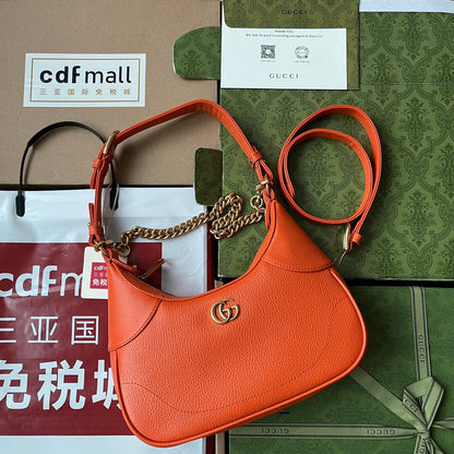 SAC À BANDOULIÈRE 25 EN CUIR DE VEAU ORANGE QUINCAILLERIE DORÉ