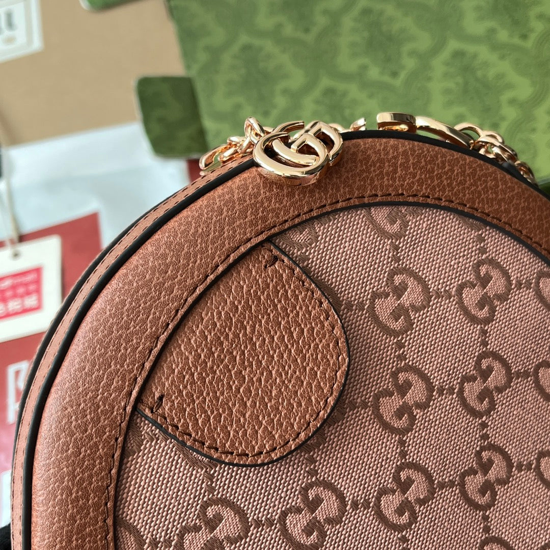 Mini sac bandoulière rond OPHIDIA 18 pouces en toile rose poudré et bordure en cuir marron