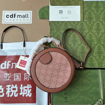 Mini sac bandoulière rond OPHIDIA 18 pouces en toile rose poudré et bordure en cuir marron
