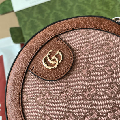 Mini sac bandoulière rond OPHIDIA 18 pouces en toile rose poudré et bordure en cuir marron