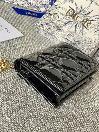 Portefeuille compact CD Caro 11 cm en cuir de veau noir brillant