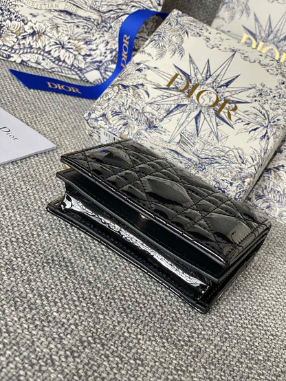 Portefeuille compact CD Caro 11 cm en cuir de veau noir brillant