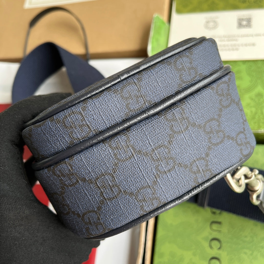 Mini sac OPHIDIA 18 en toile monogrammée bleu foncé et bordure en cuir d'agneau noir