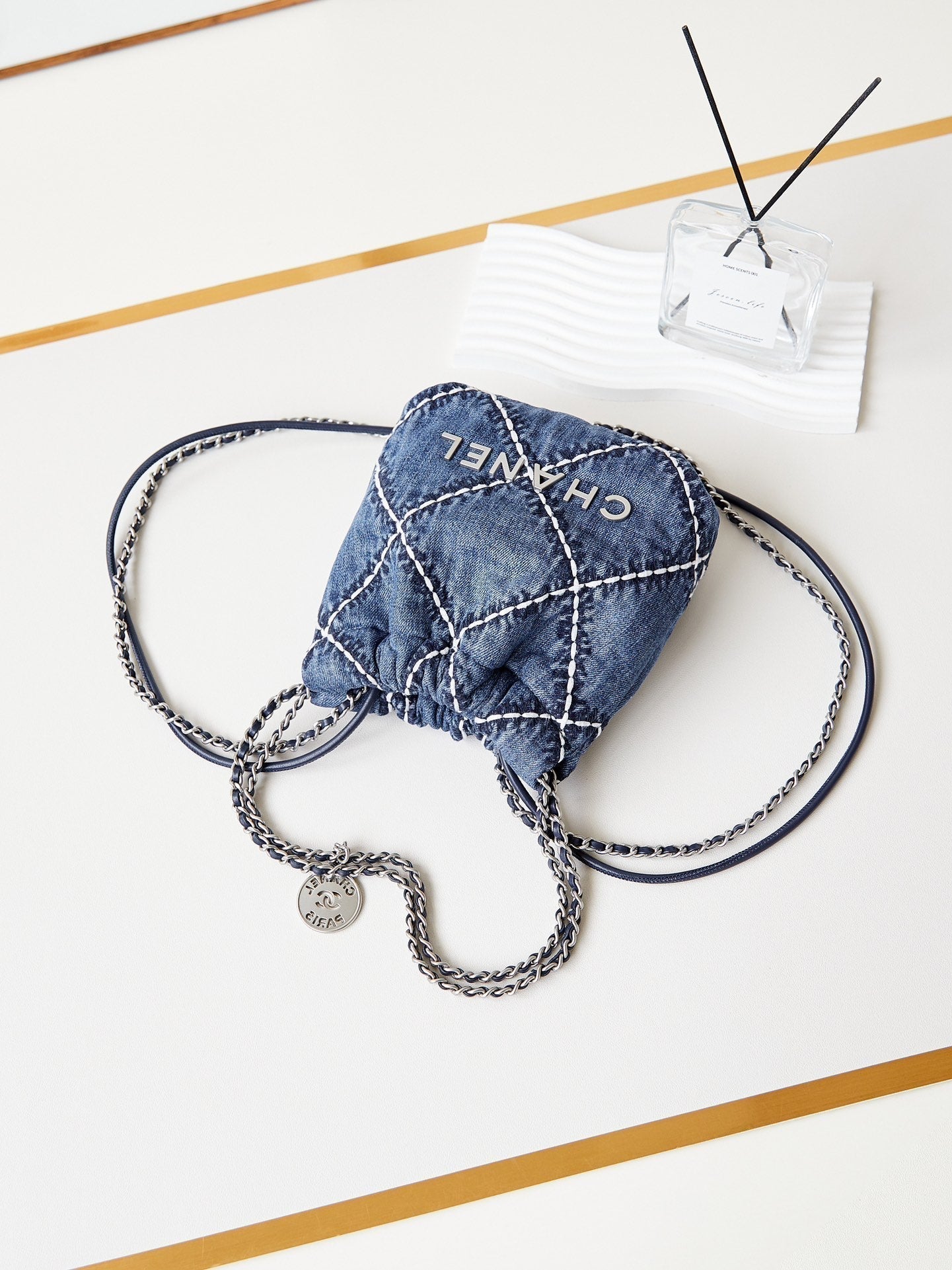 Mini sac à dos CC 22 en denim bleu cousu et matériel argenté