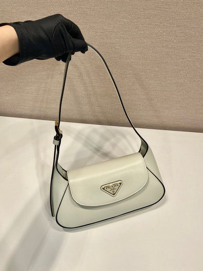 SAC À RABAT 25 EN CUIR DE VEAU LISSE BLANC LOGO TRIANGLE