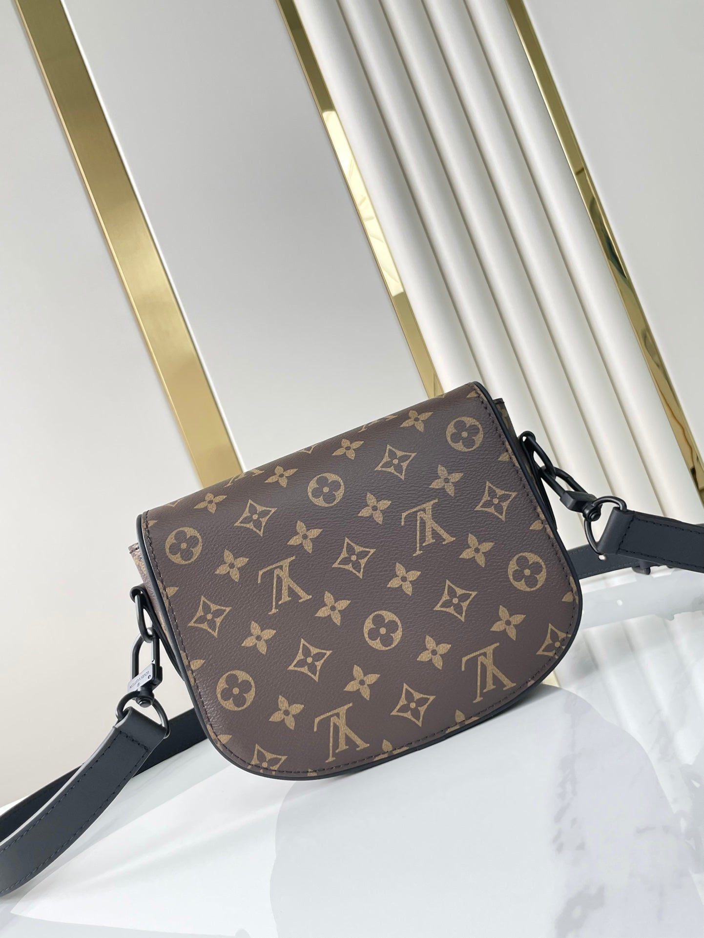 SAC MONTSOURIS MESSENGER PM 20 EN TOILE MONOGRAMME MARRON