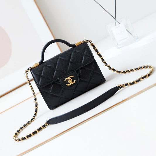 Sac à rabat 24a avec poignée supérieure 18 cm noir caviar matériel doré