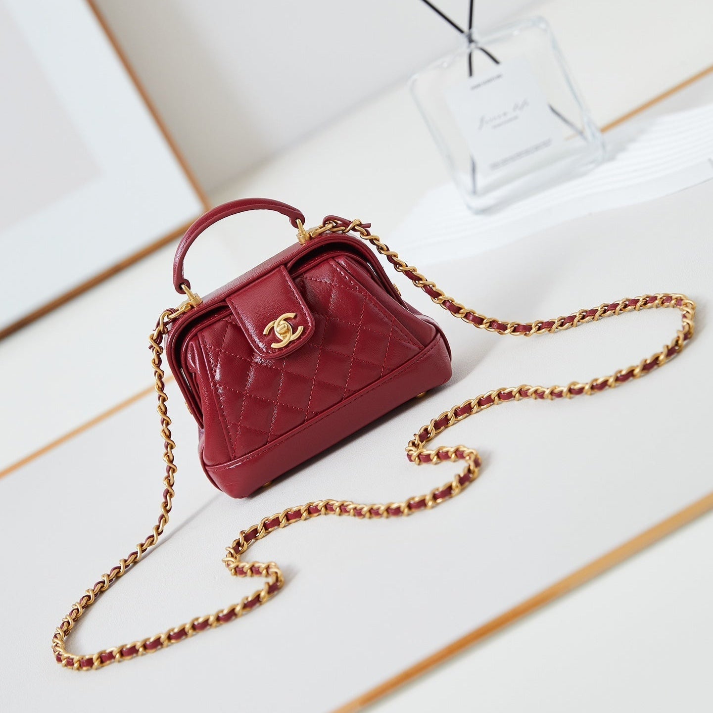 Mini poignée supérieure CC 24A 13 cm en cuir ciré rouge, accessoires dorés 238461