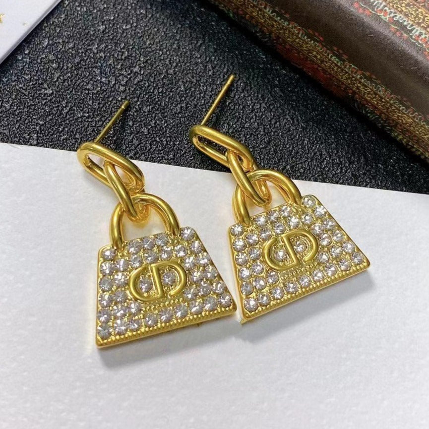 Boucles d'oreilles CD BAG en or et diamants