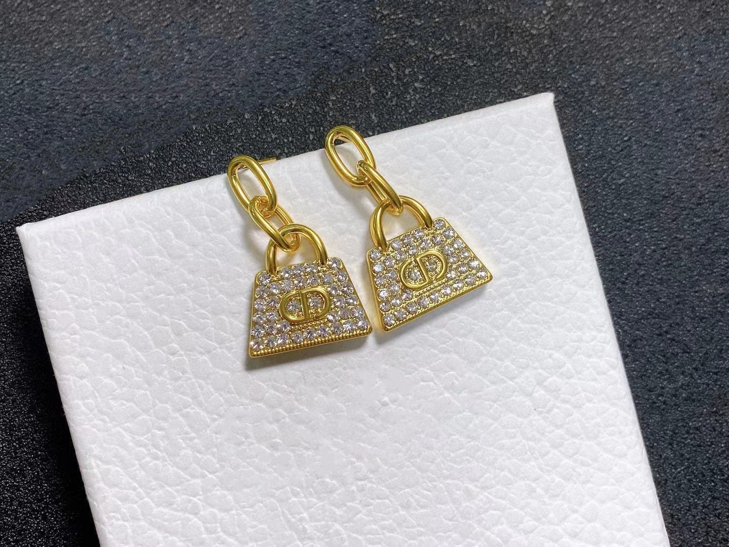 Boucles d'oreilles CD BAG en or et diamants